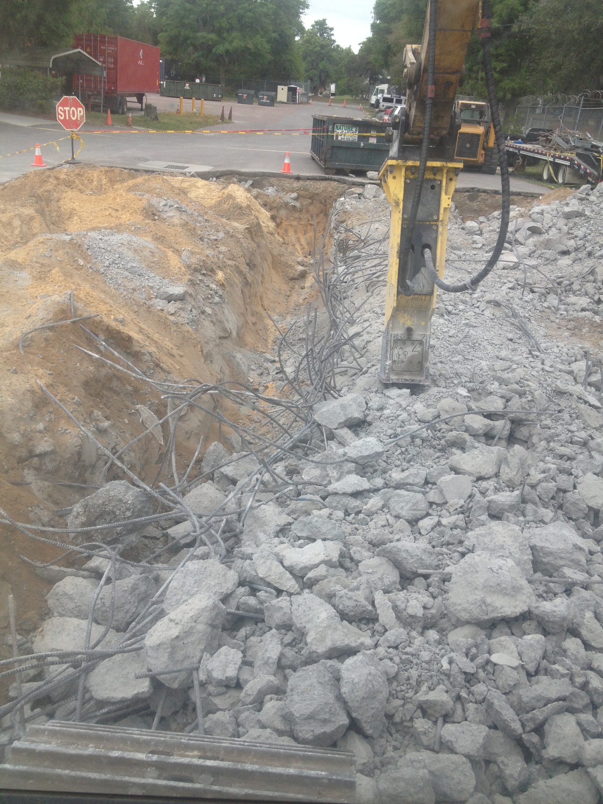 Breaking and stockpiling concrete rubble for removal