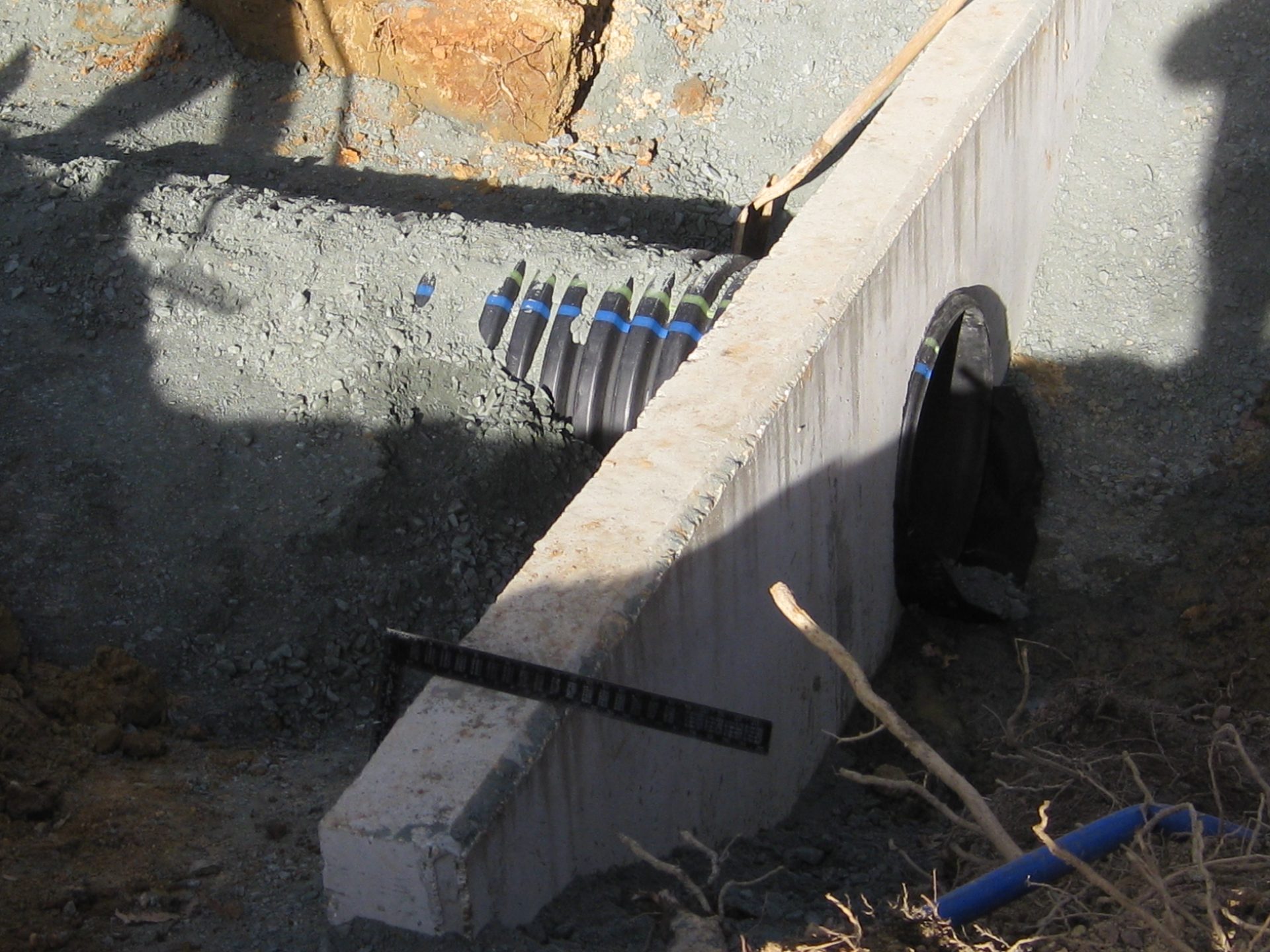 Excavator working a drainage cut on a Middle Tennessee job site