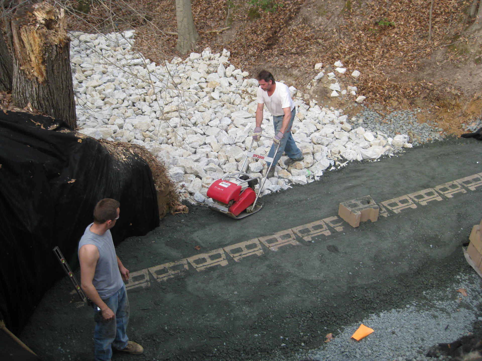 Compacting backfill over a culvert line