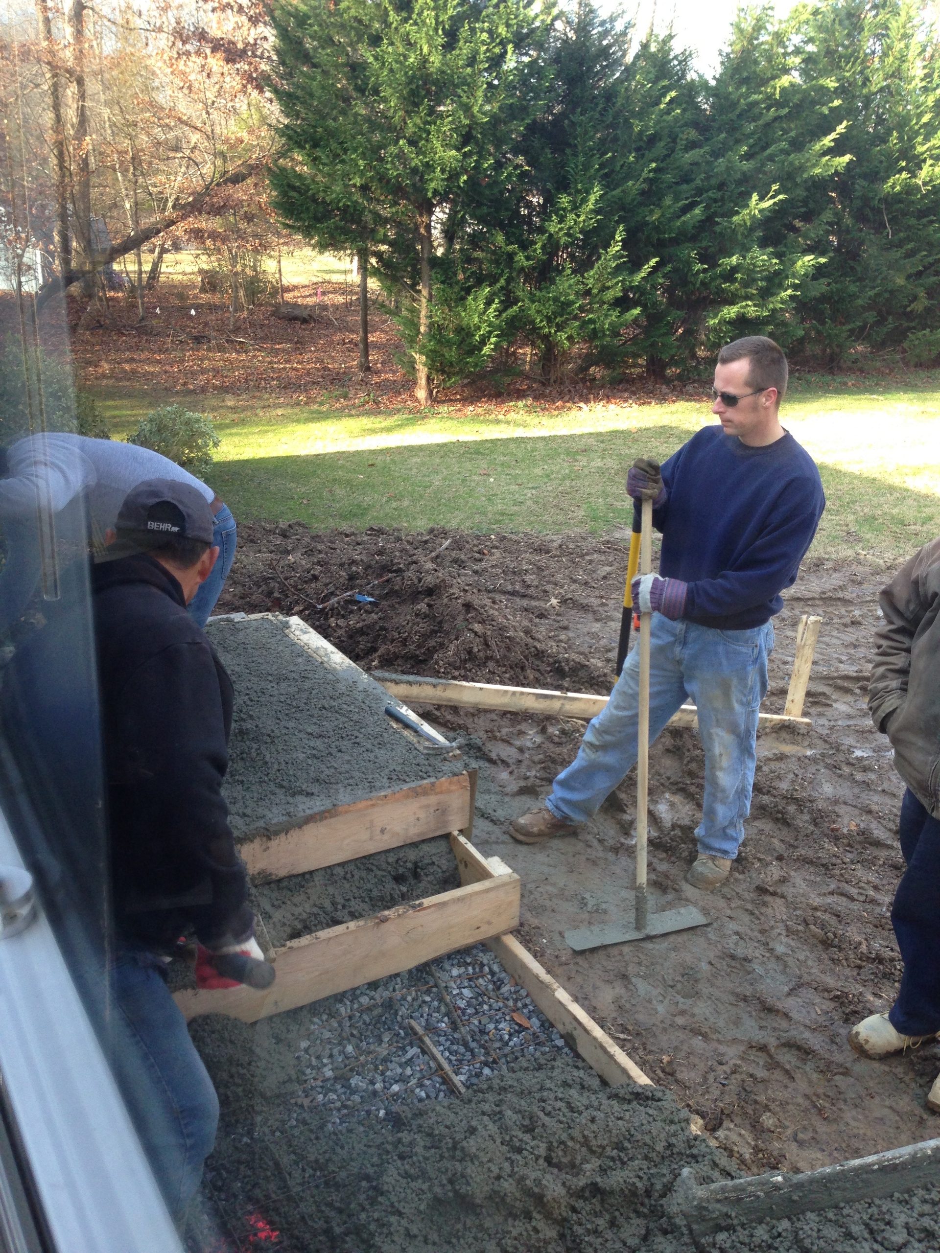 Spreading and compacting fill material