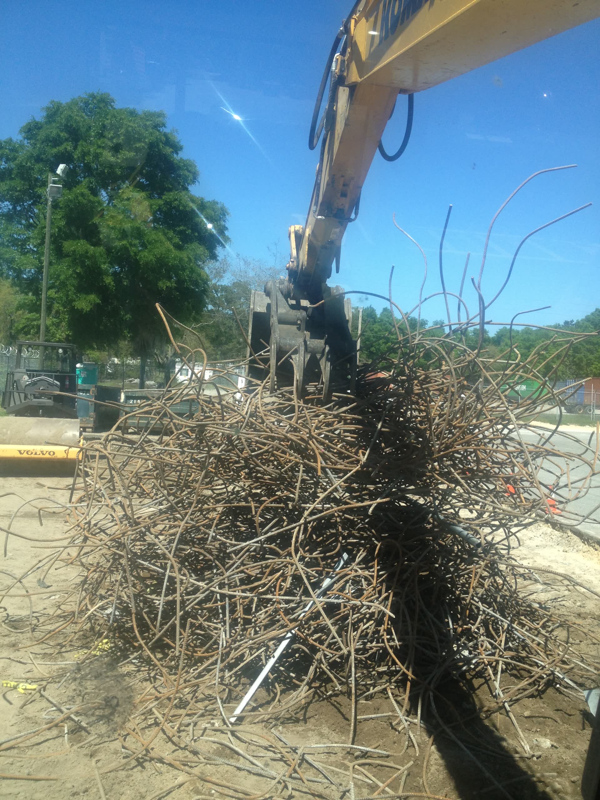 Compacted rock base built up for a structure